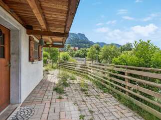 Enjoy the serene mountain views from the covered patio of this charming property.