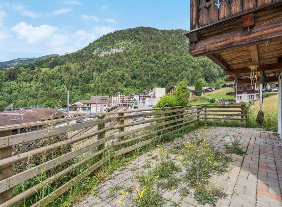 Enjoy breathtaking mountain views from this charming balcony, perfect for your morning coffee or evening relaxation.