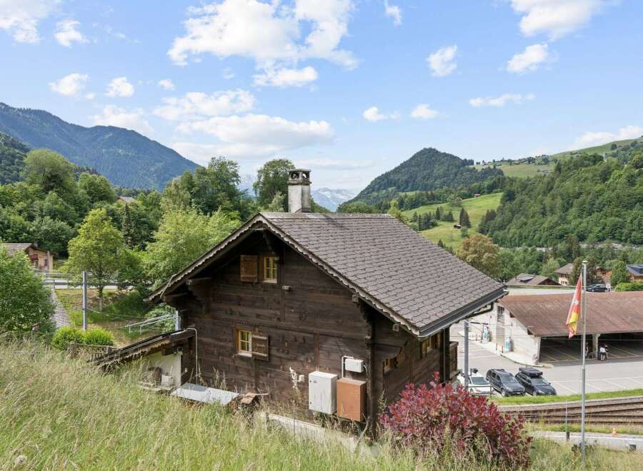 Nestled amidst the breathtaking Swiss Alps, this charming wooden chalet offers a serene mountain retreat.