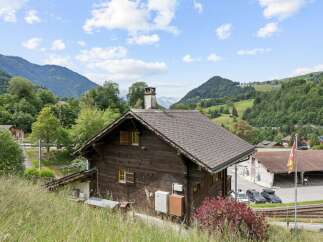 Nestled amidst the breathtaking Swiss Alps, this charming wooden chalet offers a serene mountain retreat.