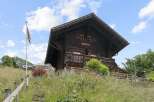 Experience rustic charm in this traditional wooden chalet, nestled on a hillside with breathtaking views.