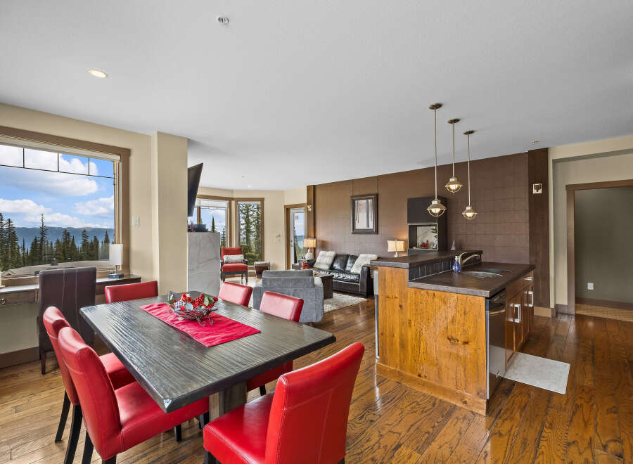 Experience breathtaking mountain views from this stunning open-concept living space, perfect for entertaining.