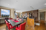 Experience breathtaking mountain views from this stunning open-concept living space, perfect for entertaining.