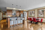 Experience modern living in this spacious open-concept kitchen and dining area, perfect for entertaining.