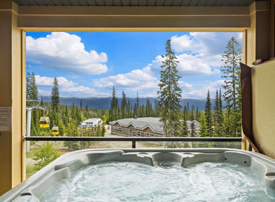 Experience ultimate relaxation with this stunning mountain view from your private hot tub.