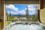 Experience ultimate relaxation with this stunning mountain view from your private hot tub.