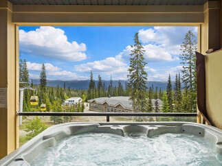 Experience ultimate relaxation with this stunning mountain view from your private hot tub.