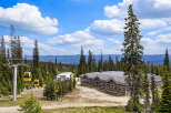 Experience the breathtaking mountain scenery from this prime location, featuring a modern lodge and a convenient ski lift system.