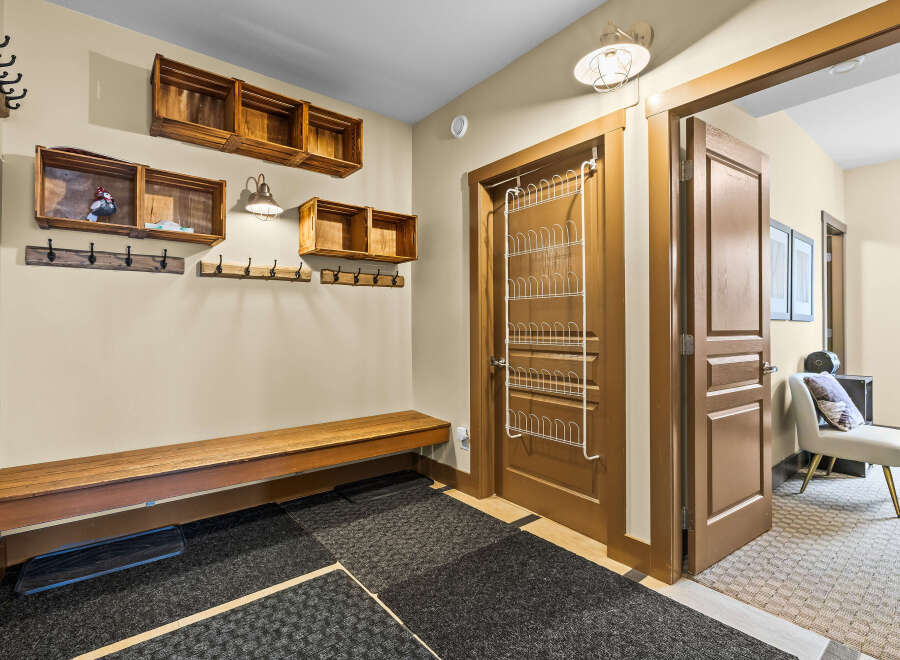 This entryway offers a practical and stylish space for organization and comfort.