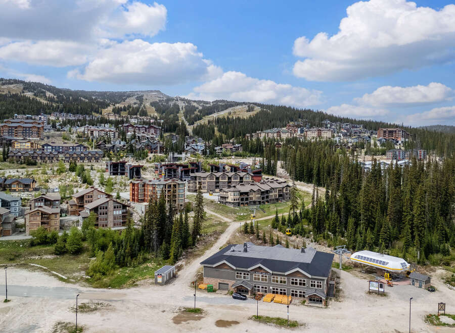 Discover this stunning mountain resort village offering a vibrant community with a mix of modern condos and chalets nestled amidst lush evergreen forests.