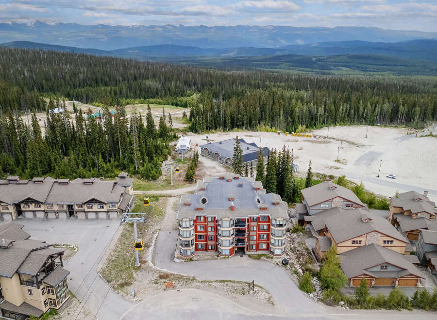 Experience mountain living at its finest with this stunning ski resort property, featuring modern architecture and breathtaking panoramic views.