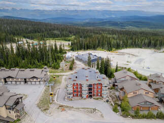 Experience mountain living at its finest with this stunning ski resort property, featuring modern architecture and breathtaking panoramic views.