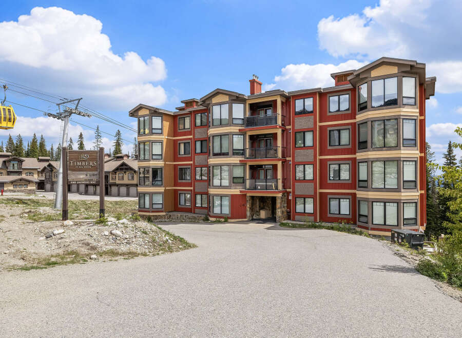 Experience luxury mountain living at The Timbers at Big White, featuring this stunning condo with panoramic views.