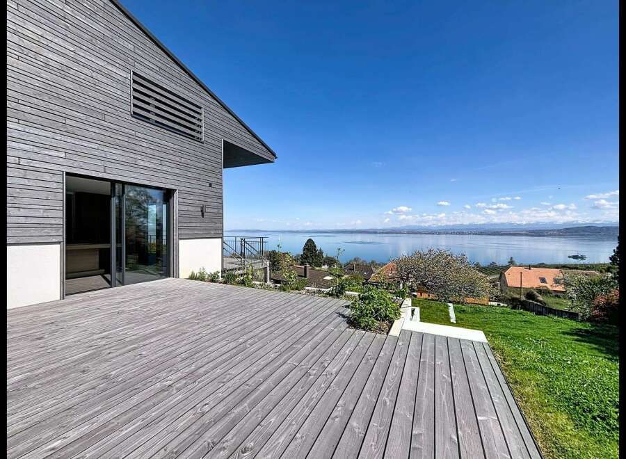 Experience modern living with this stunning property featuring a spacious wooden deck perfect for outdoor entertaining.