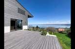 Experience modern living with this stunning property featuring a spacious wooden deck perfect for outdoor entertaining.