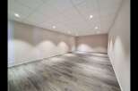 Discover this spacious and modern commercial space, featuring a clean, neutral palette perfect for any business.