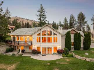 Experience luxury living in this stunning home, featuring a grand two-story great room with expansive windows that flood the space with natural light.