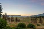 Experience breathtaking sunset views over the lake and mountains from this stunning property.