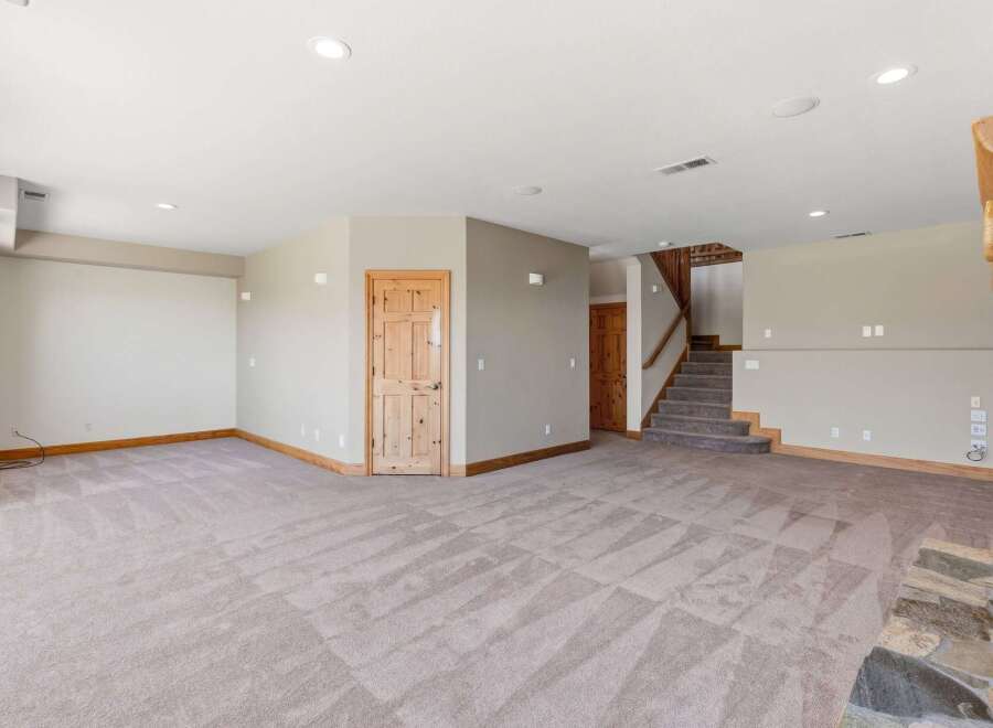Discover this spacious and inviting basement living area, perfect for entertainment and relaxation.