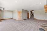 Discover this spacious and inviting basement living area, perfect for entertainment and relaxation.