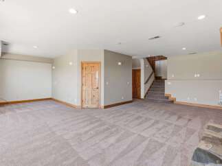 Discover this spacious and inviting basement living area, perfect for entertainment and relaxation.
