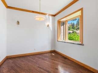 Experience breathtaking views from this stunning bay window, perfect for a formal dining room or a cozy breakfast nook.