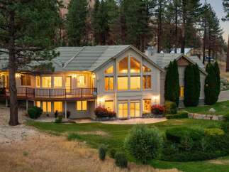 This stunning multi-level home offers breathtaking views and ample living space, perfect for entertaining.