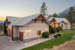 Nestled against a scenic mountain backdrop, this stunning home offers a perfect blend of rustic charm and modern elegance.