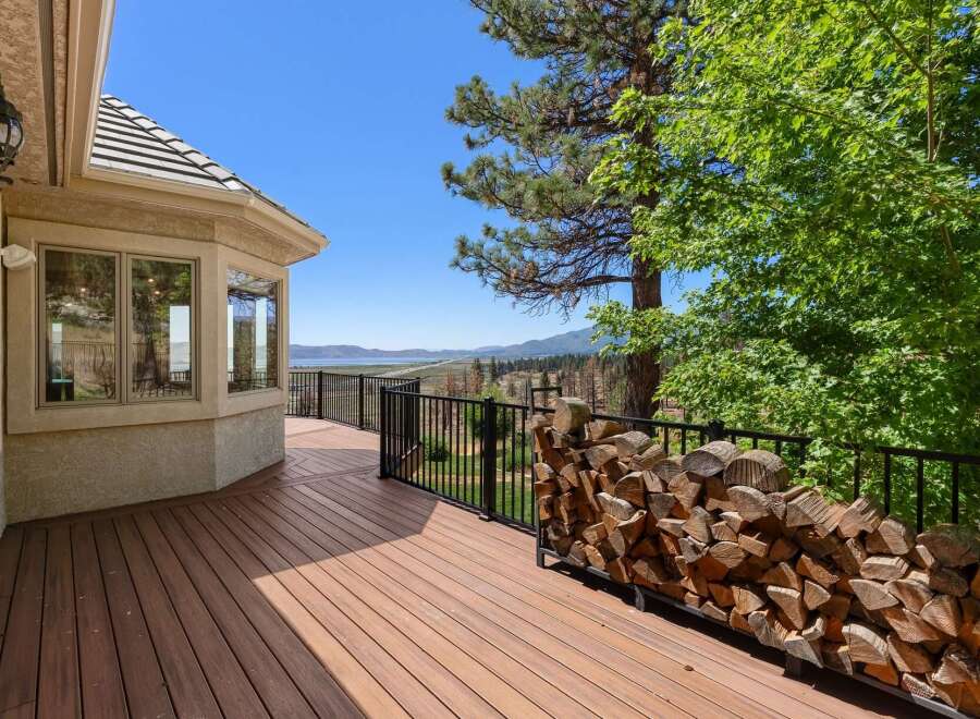 Enjoy breathtaking lake and mountain views from this expansive deck, perfect for entertaining or quiet relaxation.