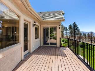 Enjoy breathtaking views from this expansive deck, perfect for outdoor entertaining or quiet relaxation.