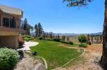 Enjoy breathtaking lake and mountain views from this stunning property, featuring a spacious deck perfect for entertaining.