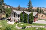 Experience luxury living in this stunning home, featuring expansive windows that flood the interior with natural light and offer breathtaking views of the surrounding landscape.
