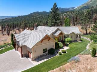 Nestled amidst a picturesque mountain landscape, this stunning home offers a perfect blend of luxury and natural beauty.
