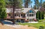 Nestled amidst towering pine trees, this stunning multi-level home offers breathtaking views and abundant natural light.
