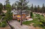 Experience luxury living in this stunning multi-level home nestled amidst a serene pine forest.