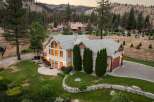 Experience luxury living in this stunning estate, nestled amidst a picturesque mountain landscape.