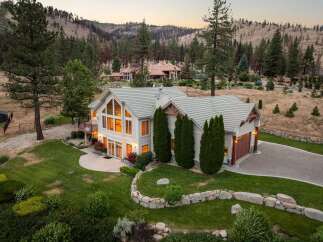 Experience luxury living in this stunning estate, nestled amidst a picturesque mountain landscape.