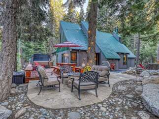 Experience the ultimate mountain retreat with this charming cabin nestled in a serene forest setting.
