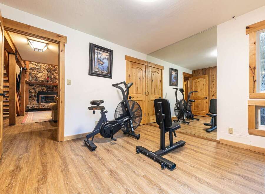 This home features a dedicated home gym space, perfect for maintaining your fitness routine without leaving the house.