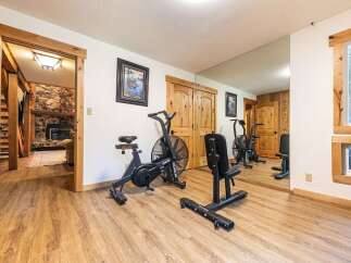 This home features a dedicated home gym space, perfect for maintaining your fitness routine without leaving the house.
