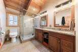 Experience luxury in this stunning bathroom featuring a spacious glass-enclosed shower with elegant tilework.