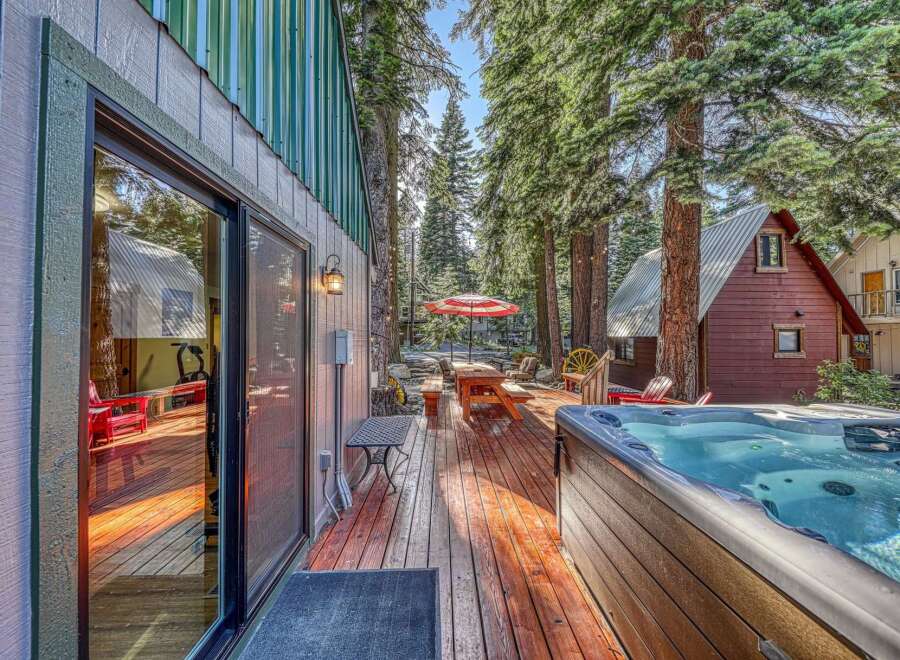 Experience ultimate relaxation in this charming cabin retreat, featuring a luxurious hot tub perfect for unwinding after a day of adventure.