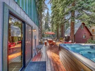 Experience ultimate relaxation in this charming cabin retreat, featuring a luxurious hot tub perfect for unwinding after a day of adventure.