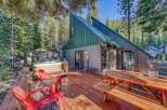 Escape to this charming A-frame cabin nestled in a serene forest setting.
