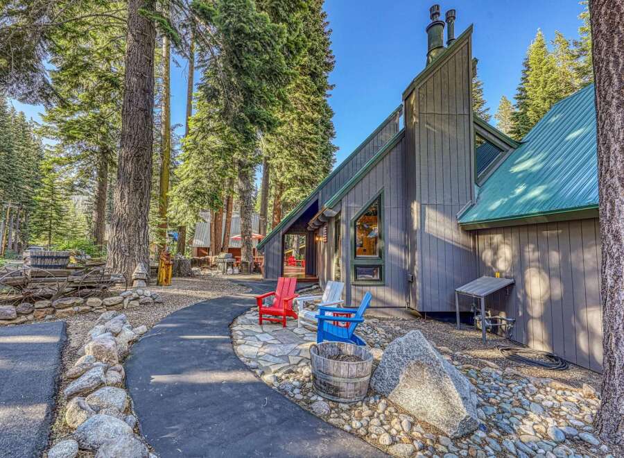 Nestled amidst towering pine trees, this charming property offers a serene mountain retreat.