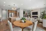 Experience modern living in this open-concept space featuring a gourmet kitchen with a large island and sleek cabinetry.