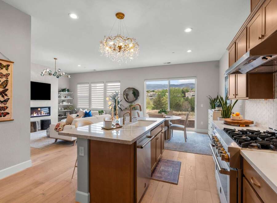 Experience modern living in this stunning open-concept home, featuring a gourmet kitchen with a large island and top-of-the-line appliances.