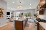 Experience modern living in this stunning open-concept home, featuring a gourmet kitchen with a large island and top-of-the-line appliances.