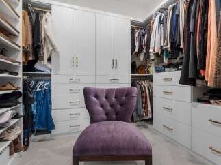 Step into this luxurious walk-in closet, designed for ultimate organization and style.