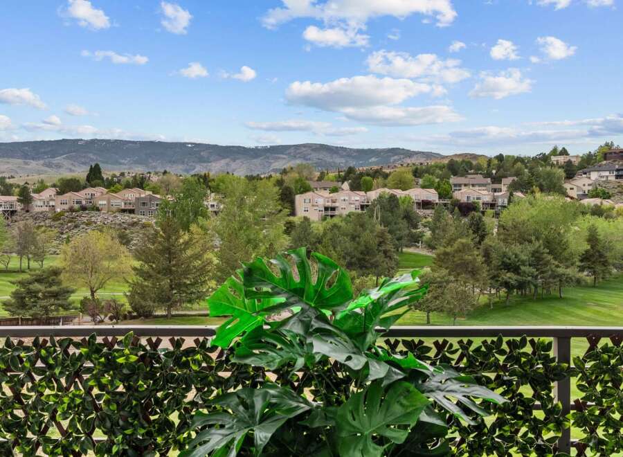 Enjoy breathtaking views from this property, overlooking a lush golf course and rolling hills.